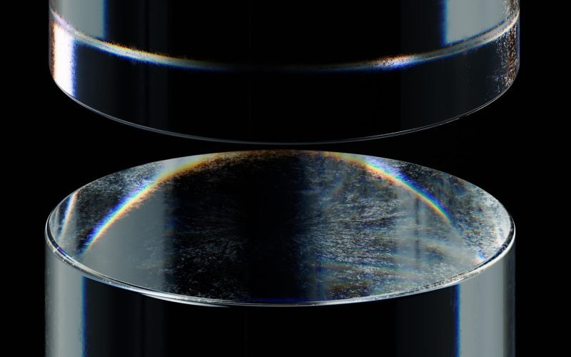 a close up of a metal object with a black background